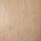 Close up texture shot of the natural light mango wood grain and smooth finish.