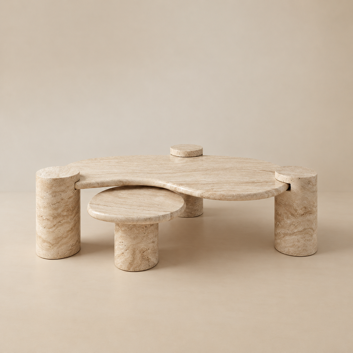 Ardea travertine coffee table set featuring a two-tier organic kidney bean shape and sturdy cylindrical stone legs.