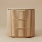 One Arden Oak Night Stand from the set of two, showing three fluted drawers and a curved oak profile, front view