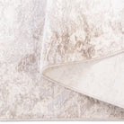 Folded corner of the Aria abstract soft-touch rug showing the soft top pile and durable woven backing construction.