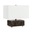 Aris marble table lamp with a white shade and brown marble base on a white background