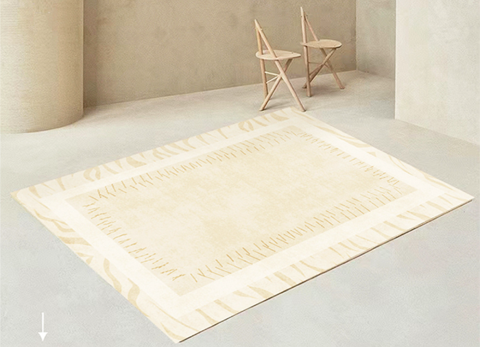 Artisan Stitched Ivory Rug styled in a minimal room with light wood chairs