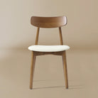 Front view of the Ash Classic dining chair with a walnut ash wood frame and cream seat