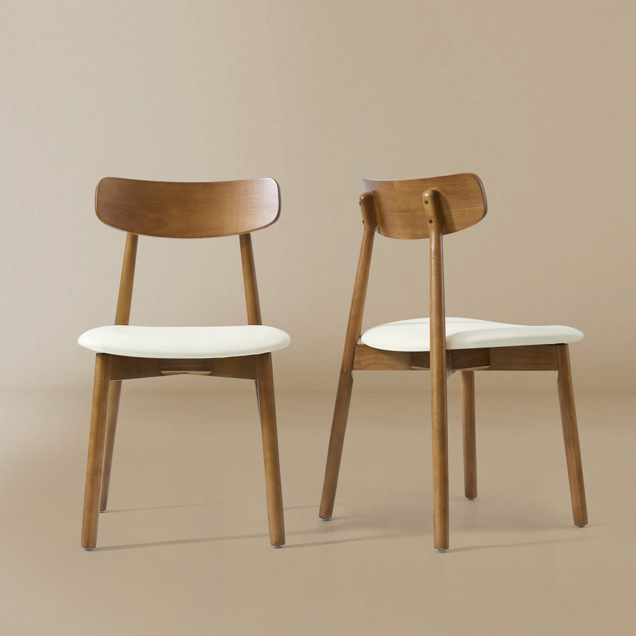 Pair of Ash Classic dining chairs with walnut ash wood frames and cream padded seats