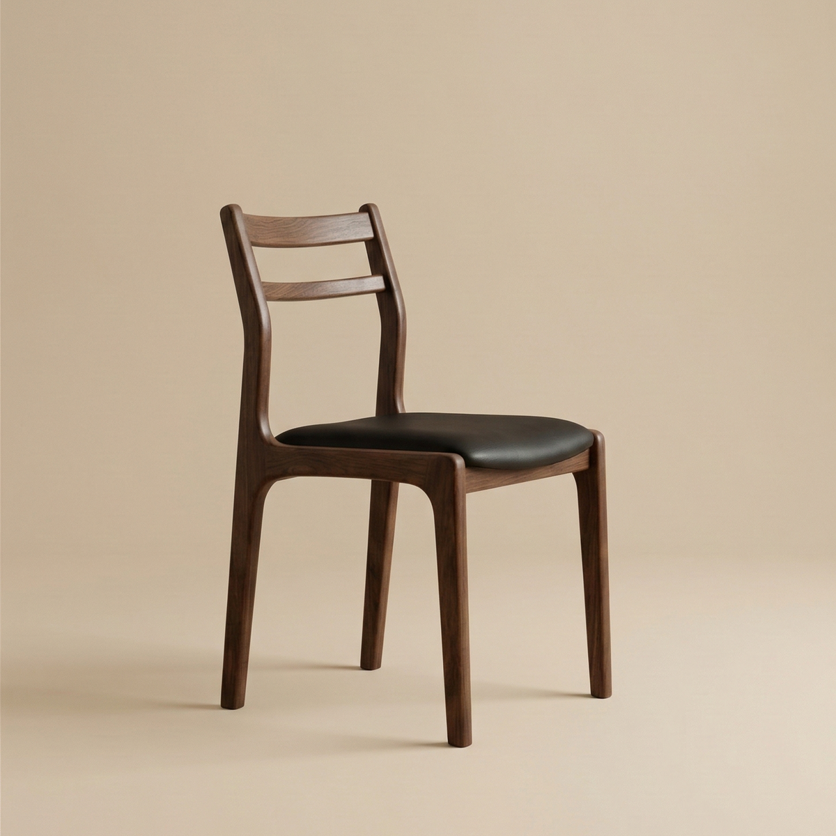 Angled view of the dark wood Aspen dining chair showing its curved slat backrest and sleek black seat