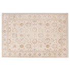 Full view of the Aurelia Vintage Floral Rug in Ivory with a light cream field, soft taupe floral motifs and muted blue accents.