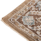 Corner detail of the Aurelia Vintage Floral Rug in Mocha showing the warm brown border, floral pattern and short fringed edge.