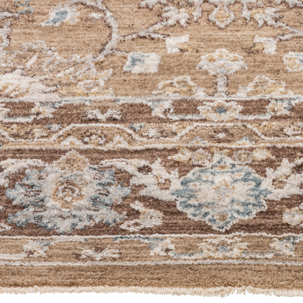 Close-up of the Aurelia Vintage Floral Rug in Mocha showing its soft-touch floral pile in brown, ivory and muted blue.