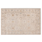 Full view of the Aurelia Vintage Floral Rug in Sand with a pale beige field, warm neutral floral motifs and muted blue accents.