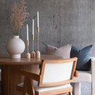 Aurelia Candle Holders styled on round wood dining table with ceramic vase and neutral decor