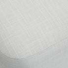 Close-up of the textured white linen upholstery on the Aurelie Linen Accent Stool.