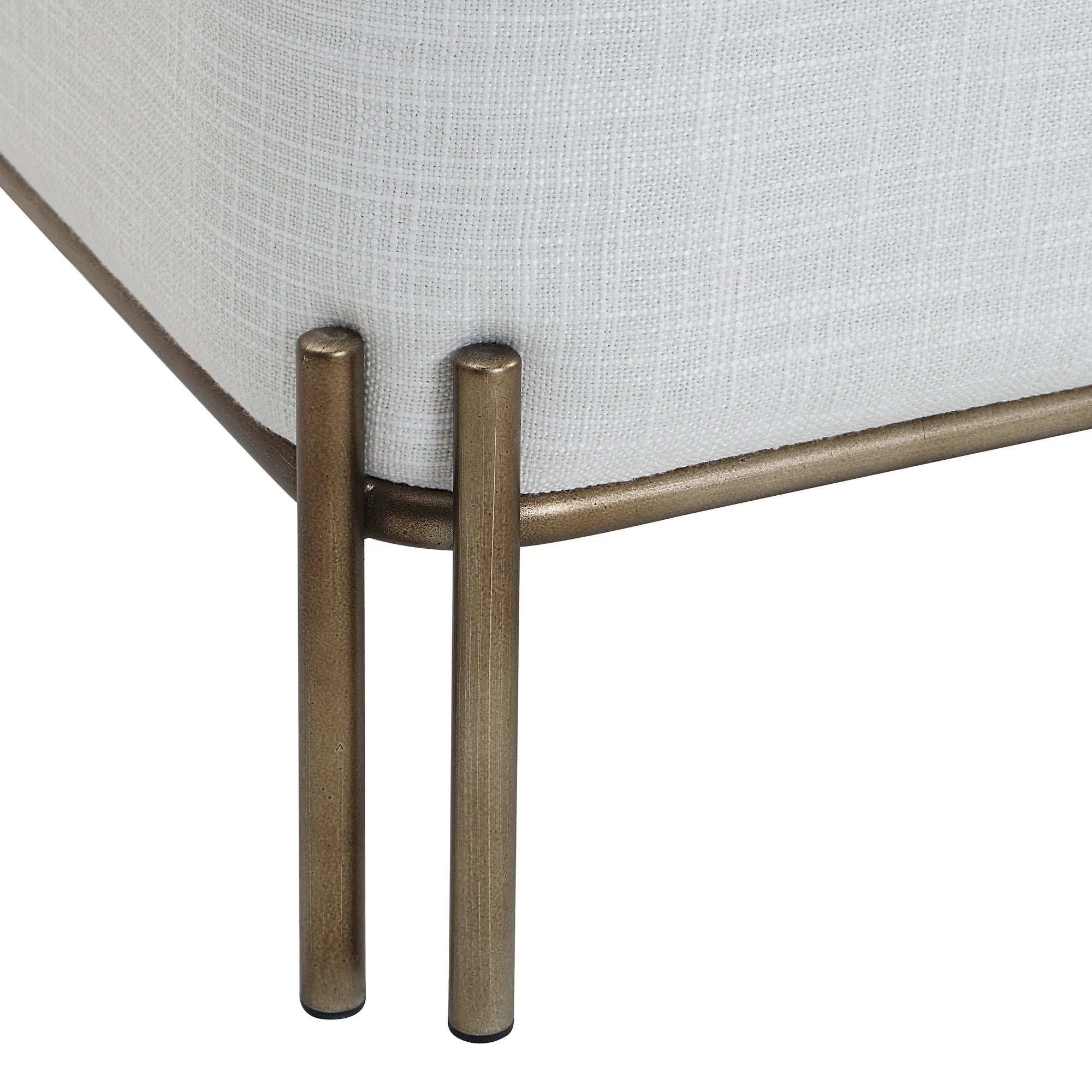 Close-up of the painted brass iron leg detail on the white Aurelie Square Linen Accent Stool.