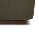 Close-up of the Aveline Velvet Bed with a wooden base on a white background