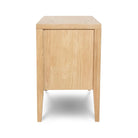 A direct side profile of the Beaumont 3-Drawer Nightstand, showcasing the clean lines and the depth of the natural oak frame.