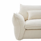 Close-up of Bella Boucle Sofa corner, showing textured fabric and clean stitching on a white background.