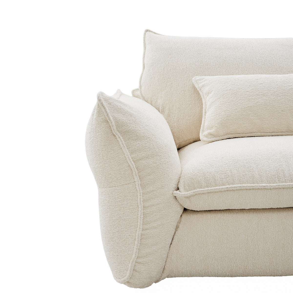 Close-up of Bella Boucle Sofa corner, showing textured fabric and clean stitching on a white background.