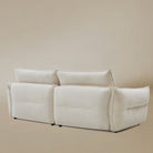 Bella Boucle Sofa in a cream boucle fabric, shown the back in angle view.