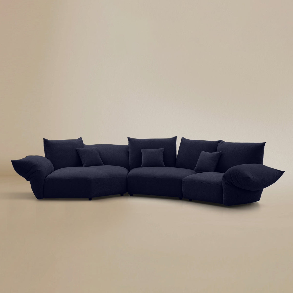 Angled view of the Blooming Embrace Modular Sofa, Combo A, in Serenity Blue chenille on a beige studio background