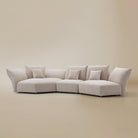 [Pearl White / Blooming Combo B (150"-169")] Angled view of the Blooming Embrace Modular Sofa, Combo B, in Pearl White chenille on a beige studio background