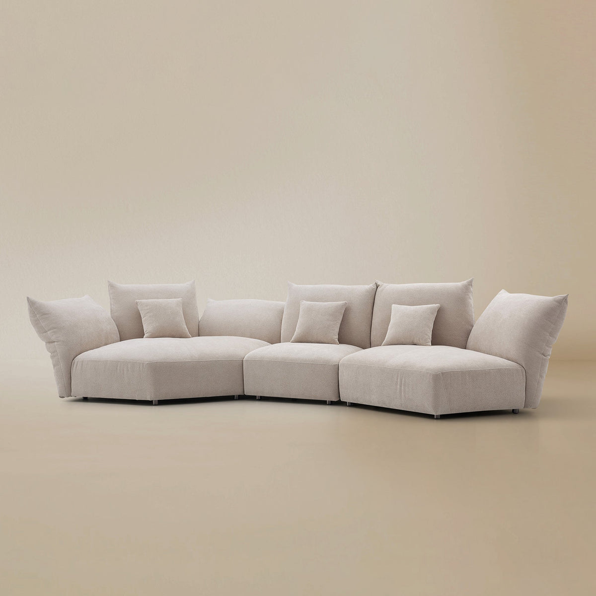 Angled view of the Blooming Embrace Modular Sofa, Combo B, in Pearl White chenille on a beige studio background