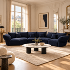[Serenity Blue / Blooming Combo C (176"-196")] Blooming Embrace Modular Sofa, Combo C, in Serenity Blue chenille in a sunlit Parisian-style living room with wall mouldings and a round stone coffee table