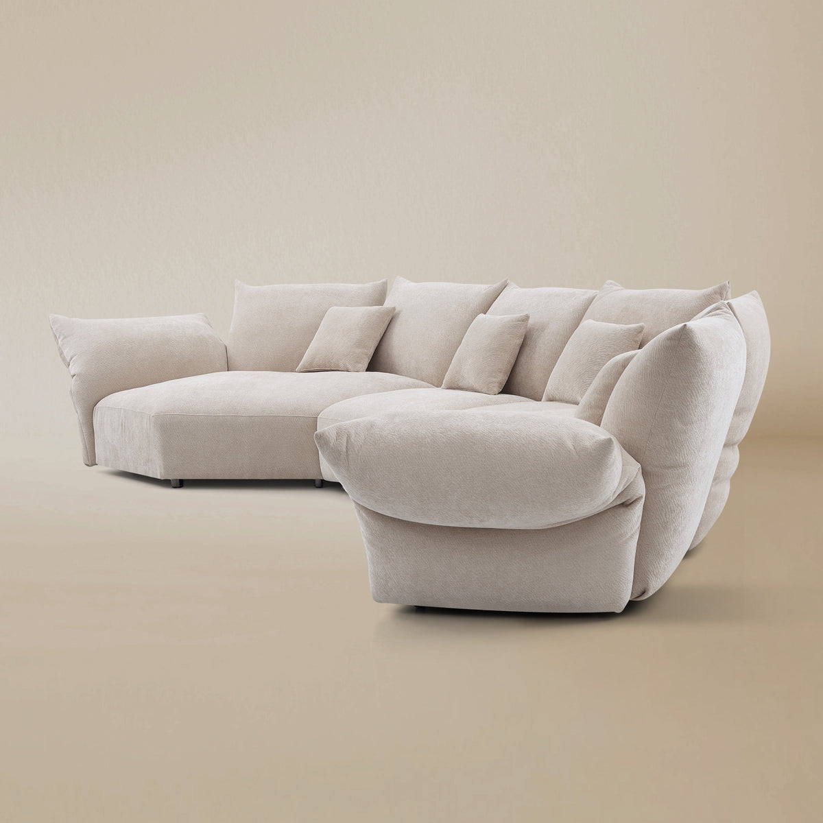 Side view of the Blooming Embrace Modular Sofa, Combo C, in Pearl White chenille on a beige studio background