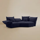 [Serenity Blue / Blooming Large Chaise with One Seater (104"-112")] Angled view of the Blooming Embrace Modular Sofa, Large Chaise with One Seater, in Serenity Blue chenille on a beige studio background