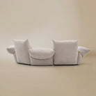 [Pearl White / Blooming Large Chaise with One Seater (104"-112")] Back view of the Blooming Embrace Modular Sofa, Large Chaise with One Seater, in Pearl White chenille on a beige studio background