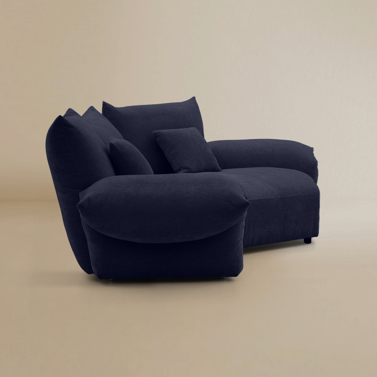 Side view of the Blooming Embrace Modular Sofa, Large Chaise with One Seater, in Serenity Blue chenille on a beige studio background
