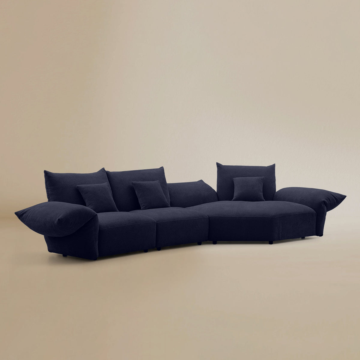 Angled view of the Blooming Embrace Modular Sofa, Large Chaise with Two Seater, in Serenity Blue chenille on a beige studio background