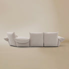 [Pearl White / Blooming Large Chaise with Two Seater (134"-152")] Back view of the Blooming Embrace Modular Sofa, Large Chaise with Two Seater, in Pearl White chenille on a beige studio background