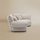 [Pearl White / Blooming Large Chaise with Two Seater (134"-152")] Side view of the Blooming Embrace Modular Sofa, Large Chaise with Two Seater, in Pearl White chenille on a beige studio background
