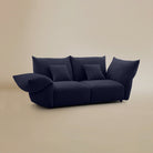 [Serenity Blue / Blooming Two Seater (86"-94")] Angled view of the Blooming Embrace Modular Sofa, Two Seater, in Serenity Blue chenille on a beige studio background