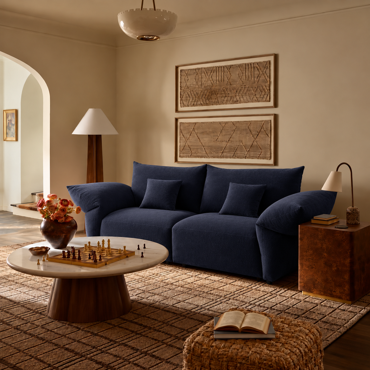 Blooming Embrace Modular Sofa, Two Seater, in Serenity Blue chenille in a warm neutral living room with an arched doorway and a round coffee table