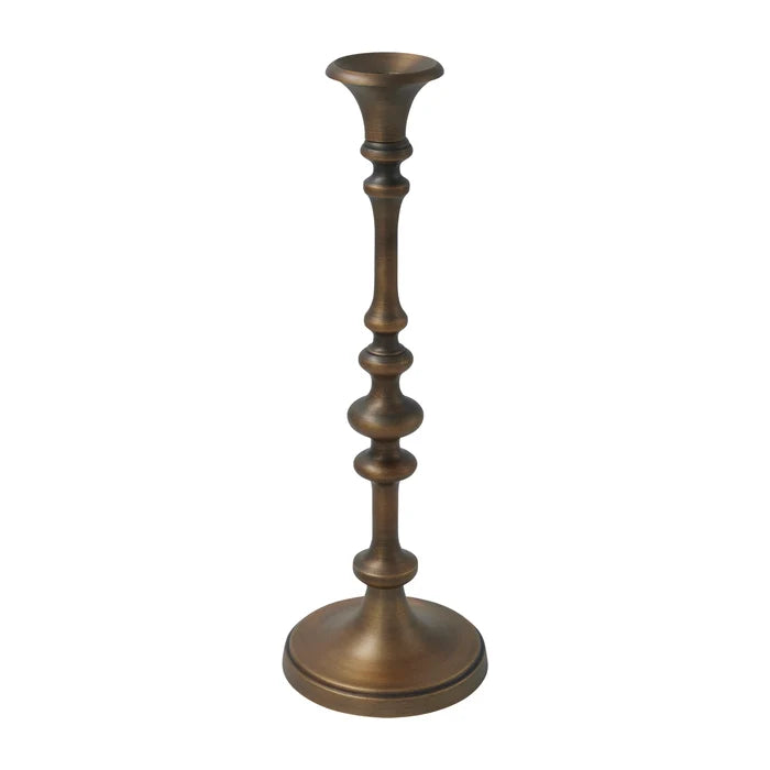 Caldria antique brass-finished candle holder showing its sculpted stem, flared candle cup, and round base.