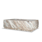 Three-quarter view of the Calista Marble Plinth Coffee Table showing the polished marble top, front and side surfaces.