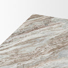 Close-up of the polished marble top on the Calista Marble Plinth Coffee Table showing flowing natural veining.