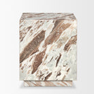 Side-angle view of the Calista Marble Plinth Side Table showing the monolithic marble body and matching recessed base.