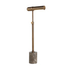 Studio view of the Calloway floor lamp showing the slender adjustable brass stem and compact marble base on a white background.