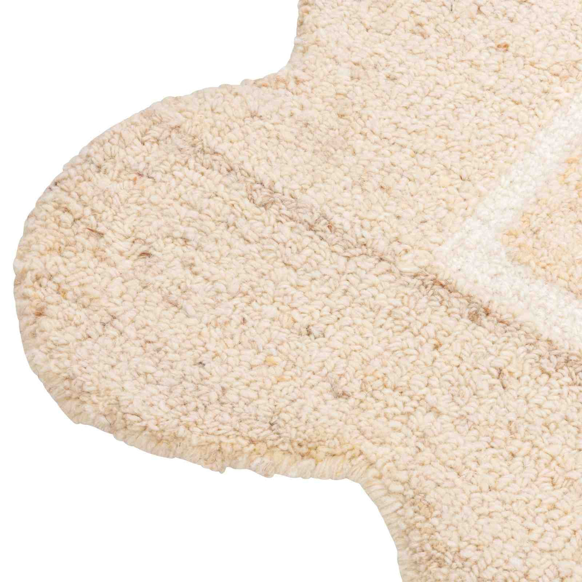 Close-up of the Camille Hand-Tufted Wool Rug showing its hand-tufted loop texture and scalloped cream edge.