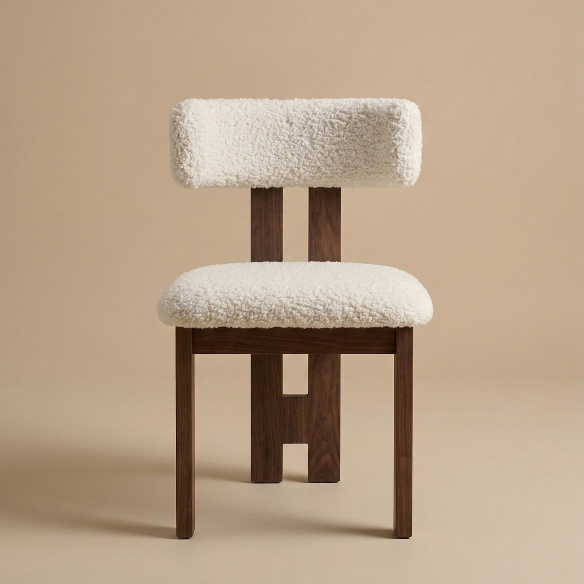 Front view of the modern dining chair featuring a dark ash wood frame with a unique central back leg and a textured white bouclé seat featuring the Casper...