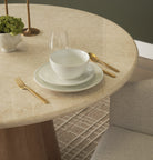 Caspia Botticino marble dining tabletop styled with neutral dinnerware