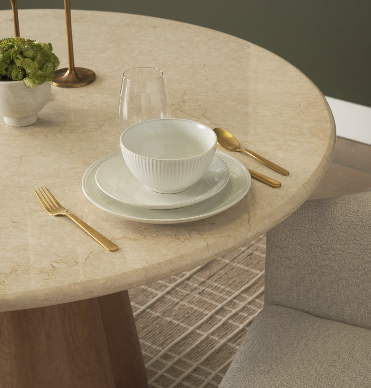 Caspia Botticino marble dining tabletop styled with neutral dinnerware