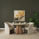 Caspia Botticino marble round dining table styled with four upholstered dining chairs