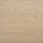 Material swatch showing the beige travertine stone used on the Cavelle Coffee Table top.