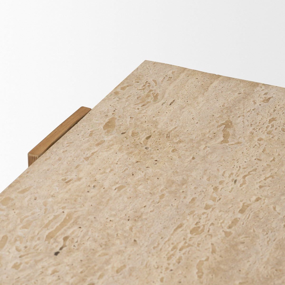 Close-up of the Cavelle Console Table top showing the natural pores and tonal variation of genuine beige travertine.