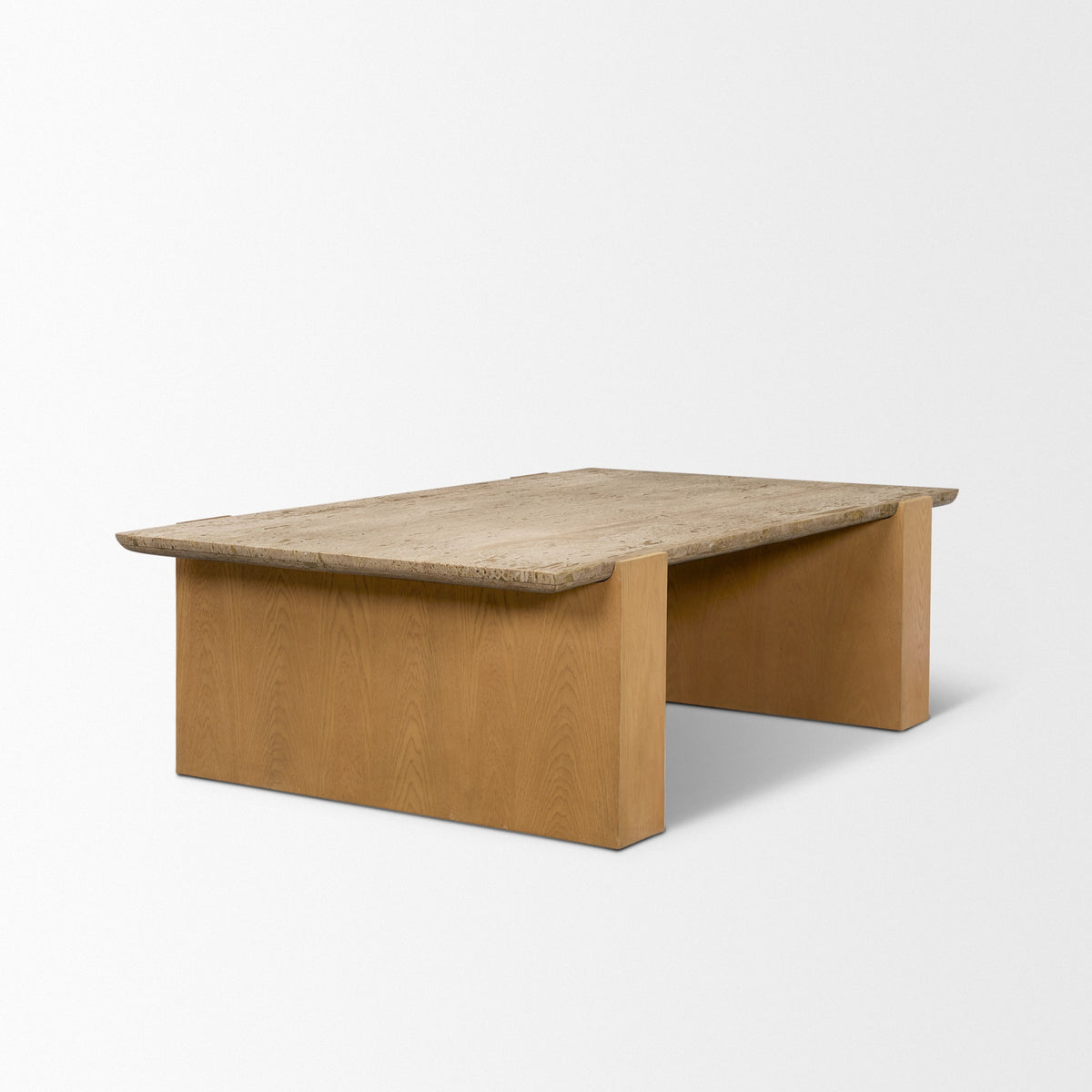 Side angle view of the Cavelle Travertine & Oak Coffee Table highlighting the broad oak blade-leg construction and travertine overhang.