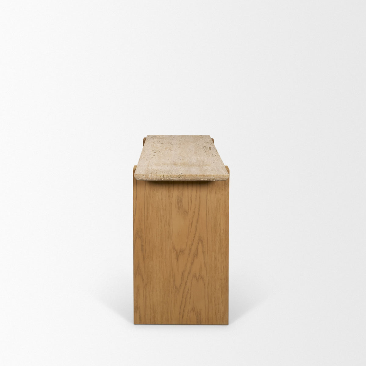 End view of the Cavelle Travertine & Oak Console Table showing the narrow profile, travertine top and solid oak panel leg.