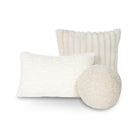 A set of three Cloudline decorative cushions including a ribbed faux fur square, a curly lumbar, and a spherical woven orb pillow.