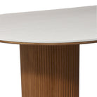 Table thickness details of the Crescent Grove Dining Table with white travertine top and walnut wood 